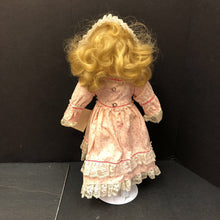 Load image into Gallery viewer, Wind Up Musical Porcelain Doll in Dress &amp; Headband w/Stand
