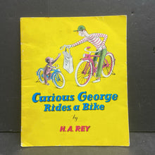 Load image into Gallery viewer, Curious George Rides a Bike (H.A. Rey) -character paperback
