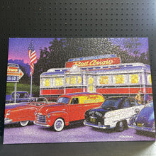 Load image into Gallery viewer, Cruisin&#39; Bruce Kaiser&#39;s &quot;Dinner at the Red Arrow Diner&quot; Jigsaw Puzzle (Masterpieces)
